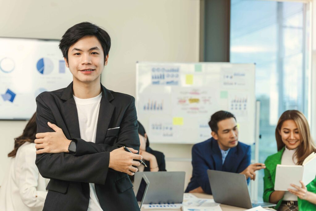Confident man presenting to business colleagues - enhanced communication through Accent Reduction in Toronto by SpeechScience